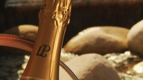 Champagne Presentation in front of water feature close up - Slider shot Stock Footage 112715489