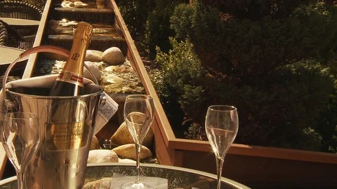 Champagne Presentation in front of a water feature - Slider shot Stock Footage 112718562