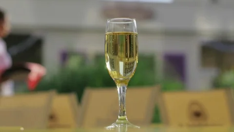 Champagne on the table, against the background of a passing waite Stock Footage 78365090
