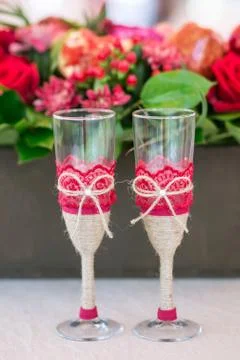 Champaign Glasses on the table with flowers on background 写真素材