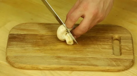 Champignon are cut with a sharp knife Stock Footage 61873953