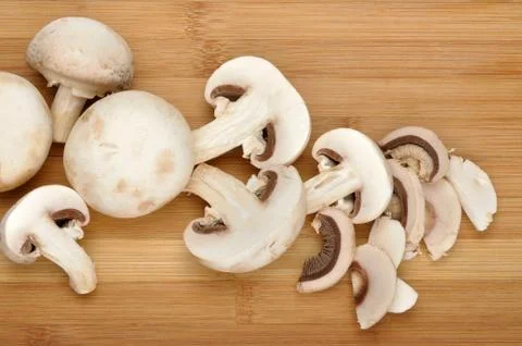 Champignon on a cutting board Stock Photos