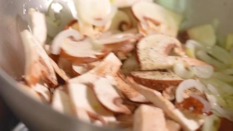 Champignons in a frying pan, close-up, slow motion. Stock Footage 225487699