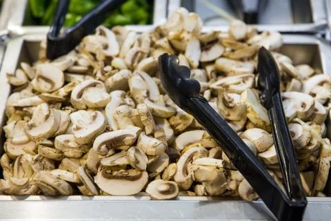 Champignons in a pan, sliced Stock Photos