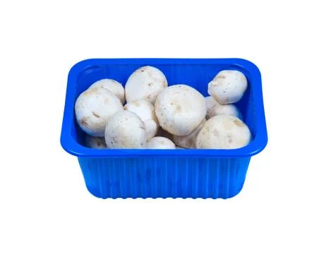 Champignons in plastic packaging isolated on white. Stock Photos