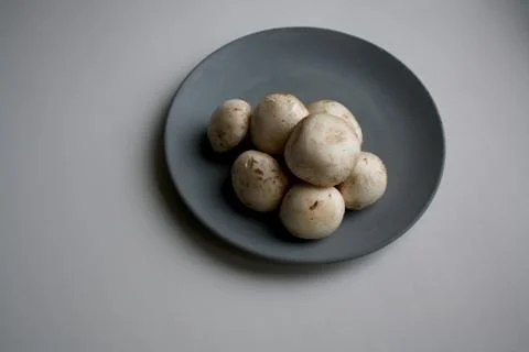 Champignons on plate Stock Photos