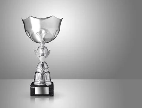 Champion silver trophy on grey background Stock Photos