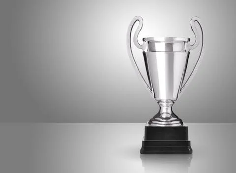 Champion silver trophy over grey background Stock Photos
