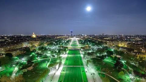 Champs de Mars from the Eiffel tower at night with rising Moon timelapse Stock Photos