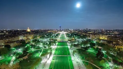 Champs de Mars from the Eiffel tower at night with rising Moon timelapse Stock Photos