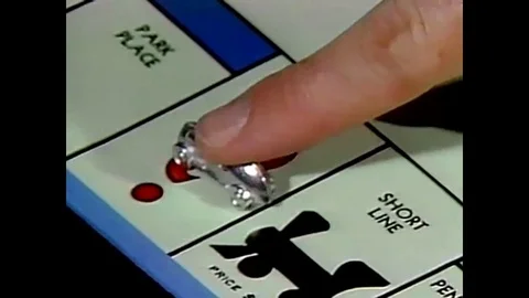 Chance and Jail rules of monopoly, exploring railroad yards through monopoly Stock Footage