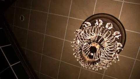 Chandelier on Brown Tile Ceiling Stock Footage 71156593
