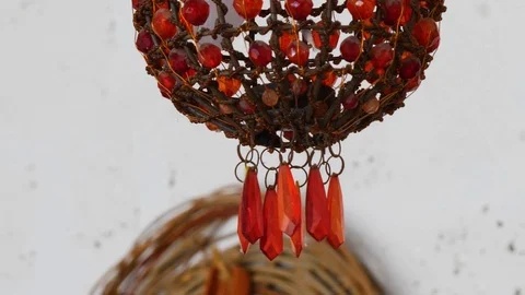 The chandelier is decorated with beads of different sizes, red 스톡 동영상 125791554