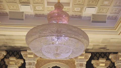 A chandelier hanging from the ceiling of a building Stock Footage 305292970