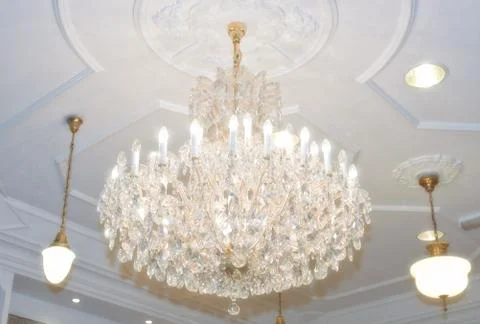 Chandelier hanging from ceiling Stock Photos