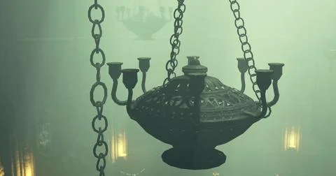 Chandelier hanging in a misty, dimly lit interior of a historic building Ilustración de archivo