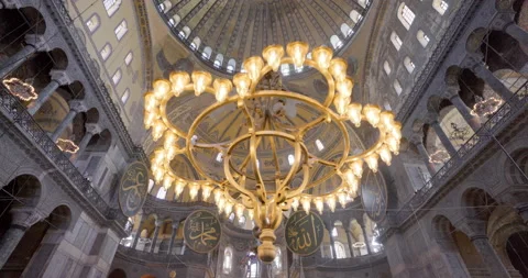 Chandeliers, domes, and murals inside the Hagia Sophia, Istanbul, Turkey Stock Footage 220909003