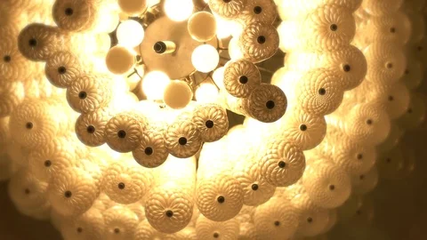 Chandeliers spiral to soft light yellow like a dream. Video stock 81108941