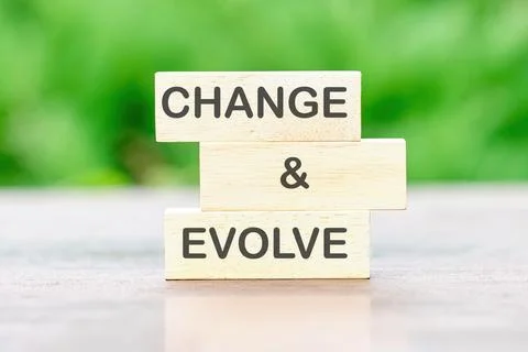 CHANGE AND EVOLVE Back to school the inscription on wooden bars against a bac Stock Photos