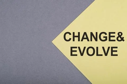 CHANGE &amp; EVOLVE text on gray-yellow background. Stock Photos
