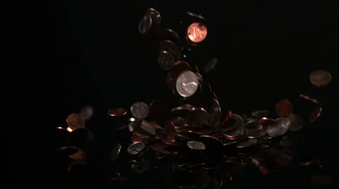 Change Falling On Black Background In Slow Motion Video stock 59673568