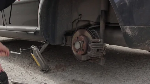 Change a flat car tire Stock Footage 90814333