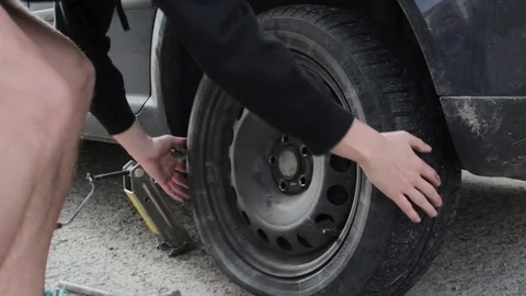 Change a flat car tire Stock Footage 90814338