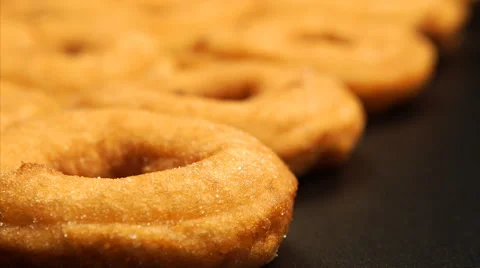 Change of focus along the row of doughnuts Stock Footage 50593127