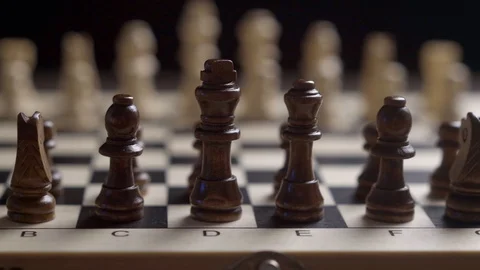 Change of focus of the camera white chess against the background of black chess Stock Footage 123061380