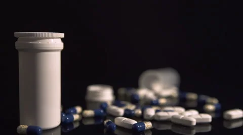 Change focus from Containers to tablets and pills Stock Footage 46694591