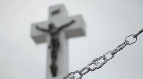 Change focus on a cross with Jesus Stock Footage 924745