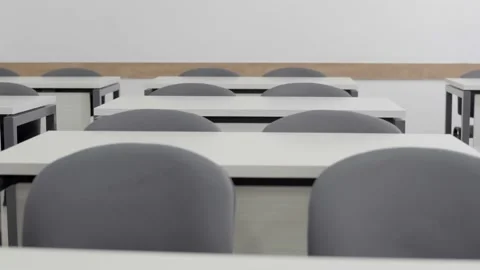 Change focus in empty classroom - from desks in background to foreground Stock Footage 144554567