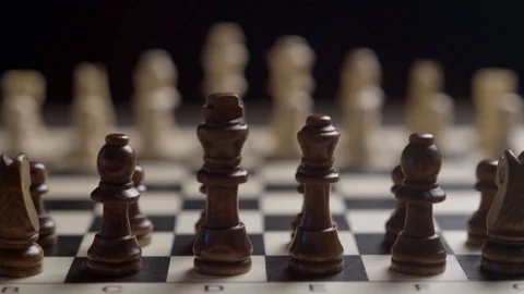 Change of focus white chess against the background of black chess Stock Footage 123061408