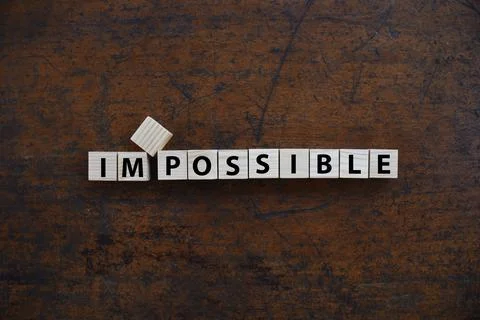 Change to IMPOSSIBLE to I'M POSSIBLE word on wood block. Foto stock