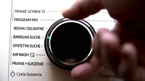 Change the knob setting on the washing machine to the program - fast washing. Video stock 231925569