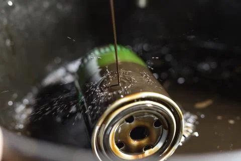 Change the old engine oil for car. Repair service. 写真素材