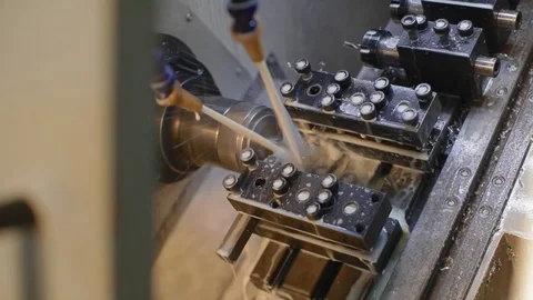 Change of position of the workpiece. The operation of CNC lathe machine with Stock Footage 130018606