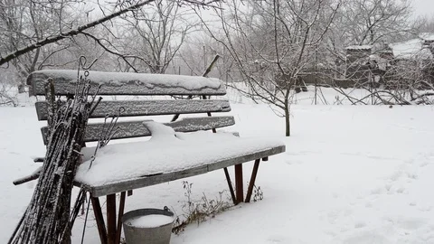 Change seasons. Transition image of bench in garden from at winter to at summer Video stock 107286976
