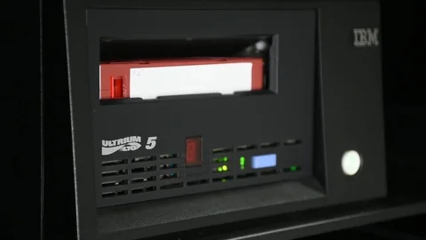 Change tape from the tape drive on Computer Server Stock Footage 77540900