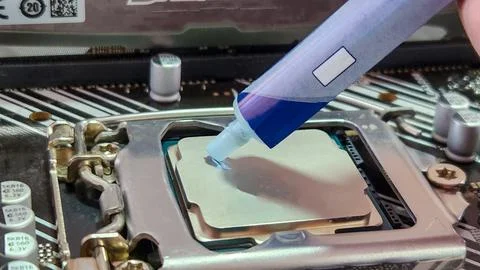Change of thermal paste to PC processor. Stock Photos