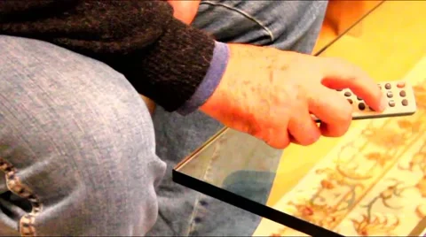 Change  TV programs using the remote control Stock Footage 45460546