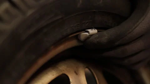 Change of a wheel in a garage Stock Footage 61016251