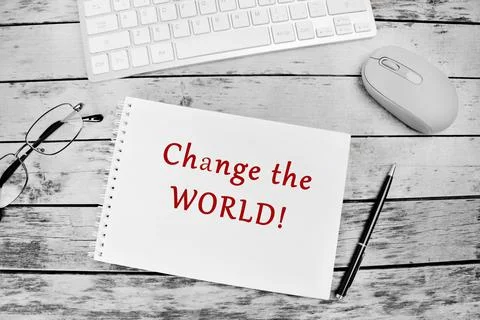 Change the world text on notebook Stock Photos