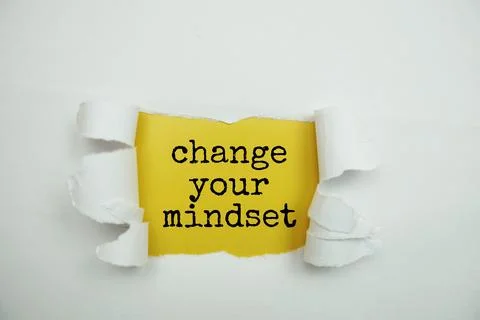 Change Your Mindset message written on yellow paper with torn paper backgroun Stock Photos