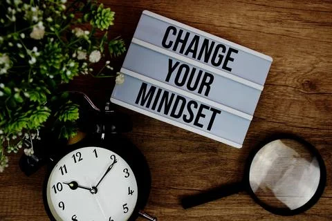 Change Your Mindset text in lightbox with magnifying glass and alarm clock .. Stock Photos
