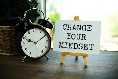 Change your mindset text message on paper card with wooden easel on wooden .. Stock Photos