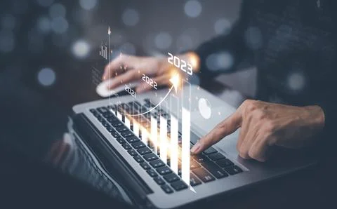 Changes in new planning, Hand using laptop with number 2023 new year, start n Stock Photos