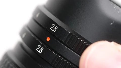 Changing the Aperture Dial Setting on A Photography Lens Stock Footage 148239784