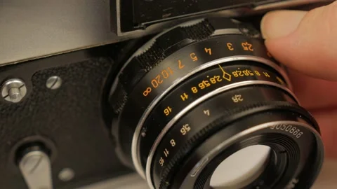 Changing The Aperture Dial Setting On A Photography Lens Stock-Footage 153370045