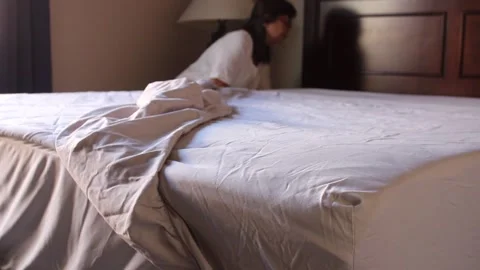 Changing bedsheet Stock Footage 168842866